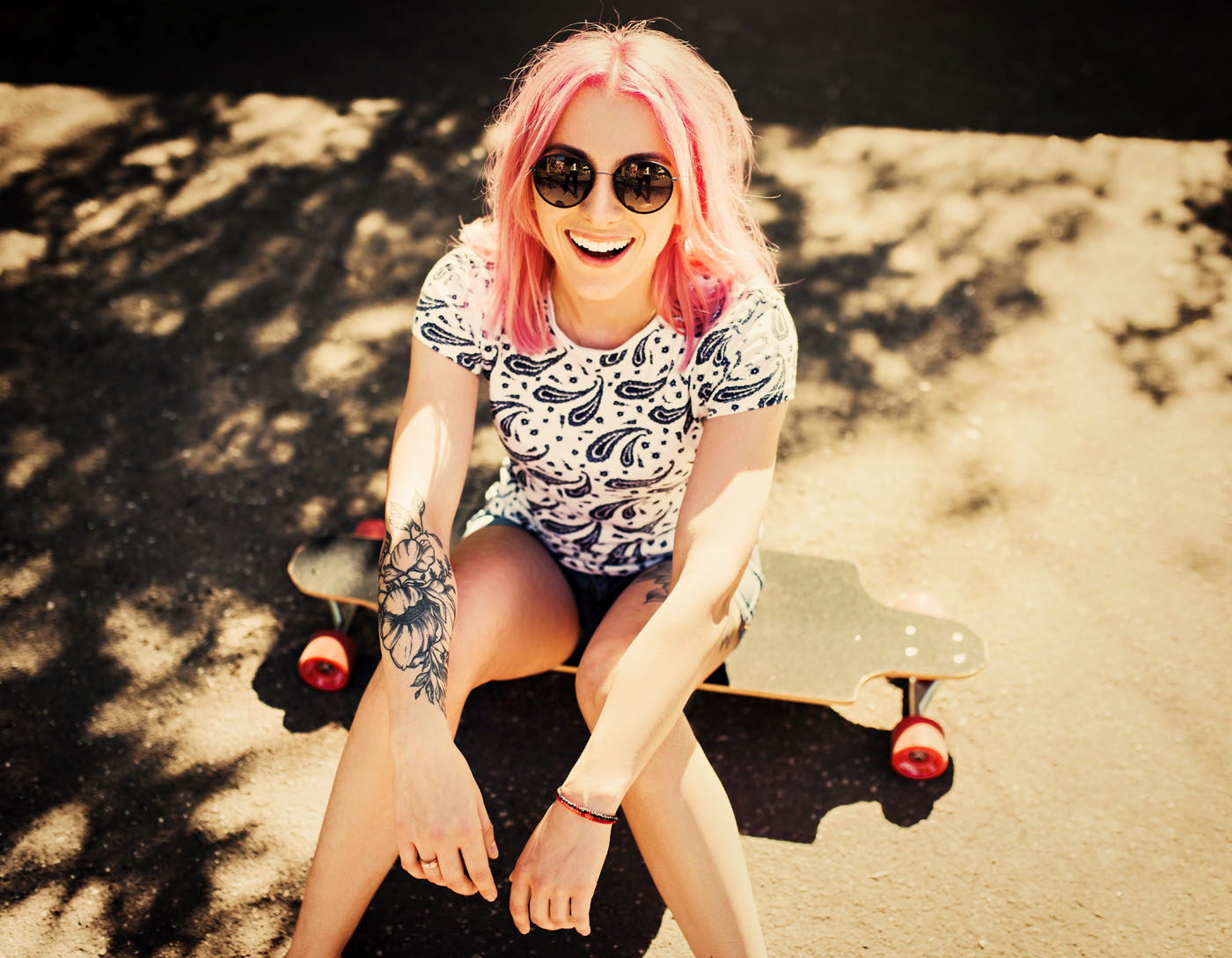 Top view of sporty beautiful smiling woman with pink hair wearin