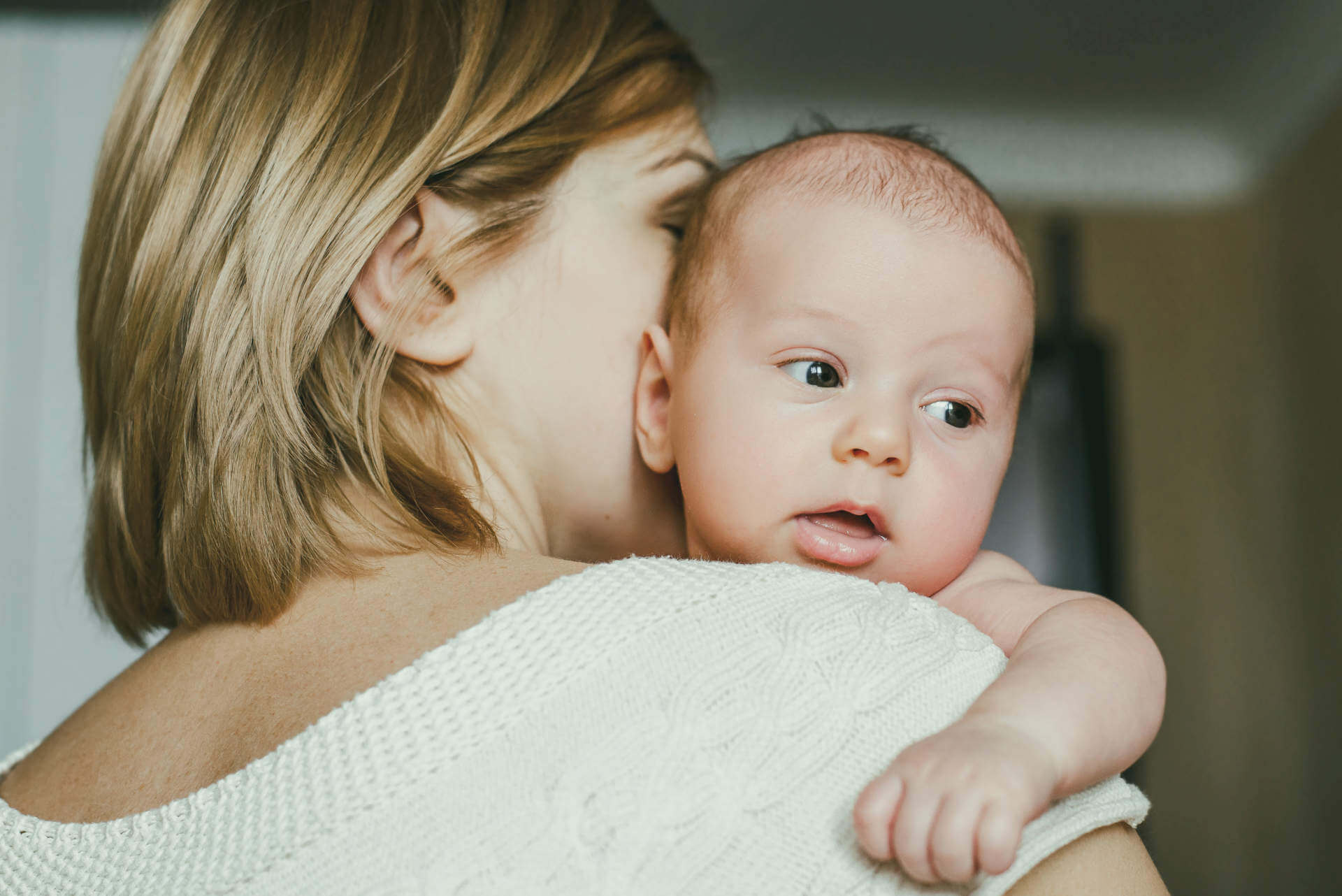 Portrait of a happy mother and baby at home. Happy motherhood