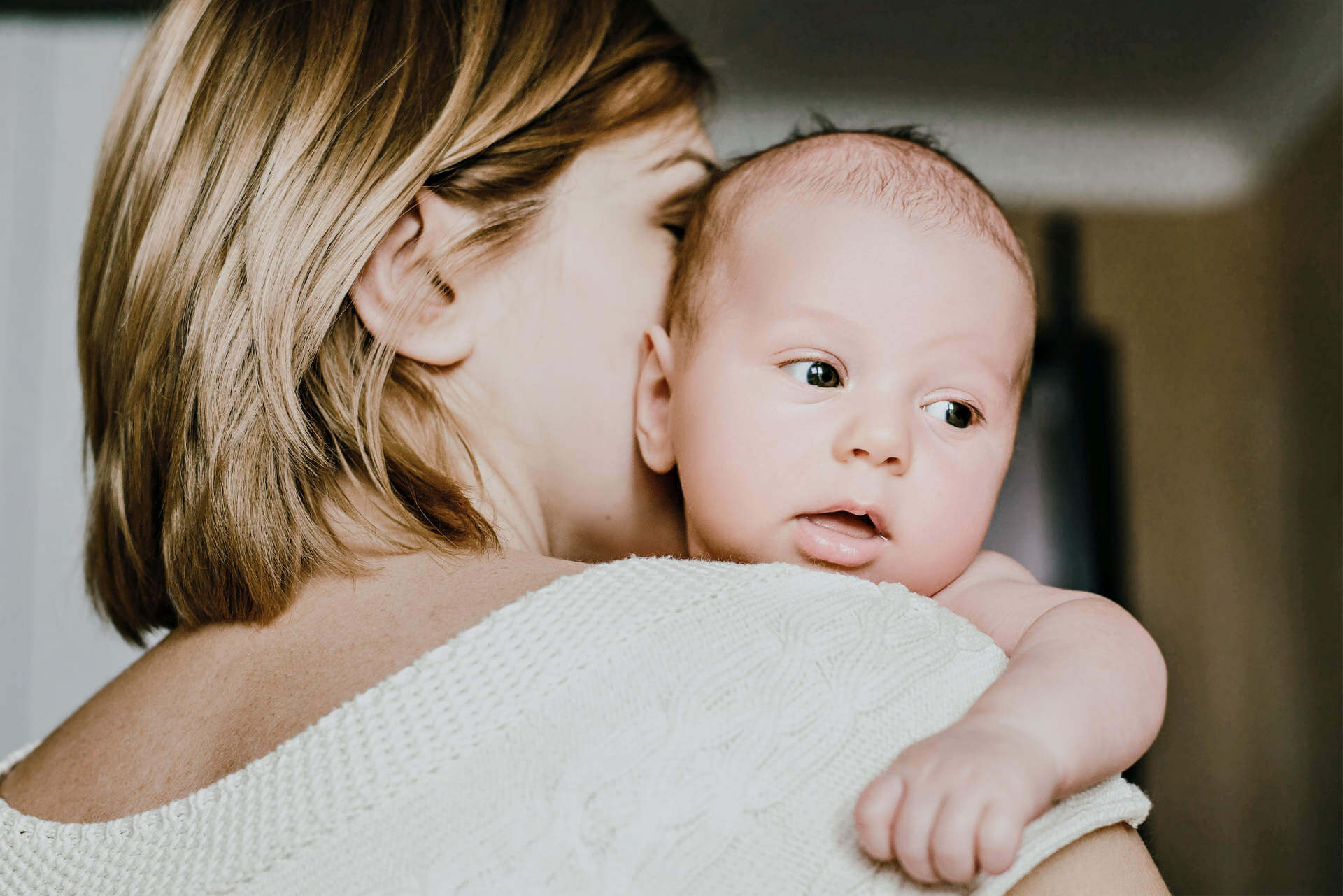 Portrait of a happy mother and baby at home. Happy motherhood