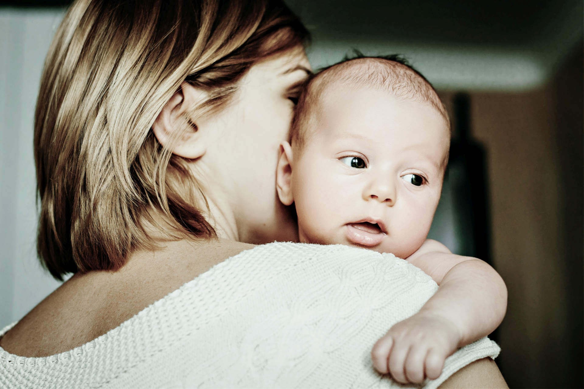 Portrait of a happy mother and baby at home. Happy motherhood