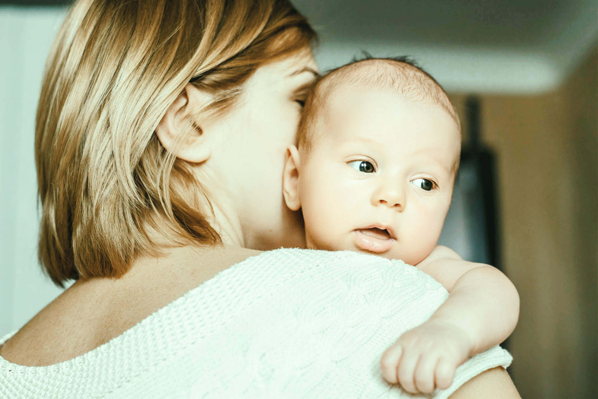 Portrait of a happy mother and baby at home. Happy motherhood