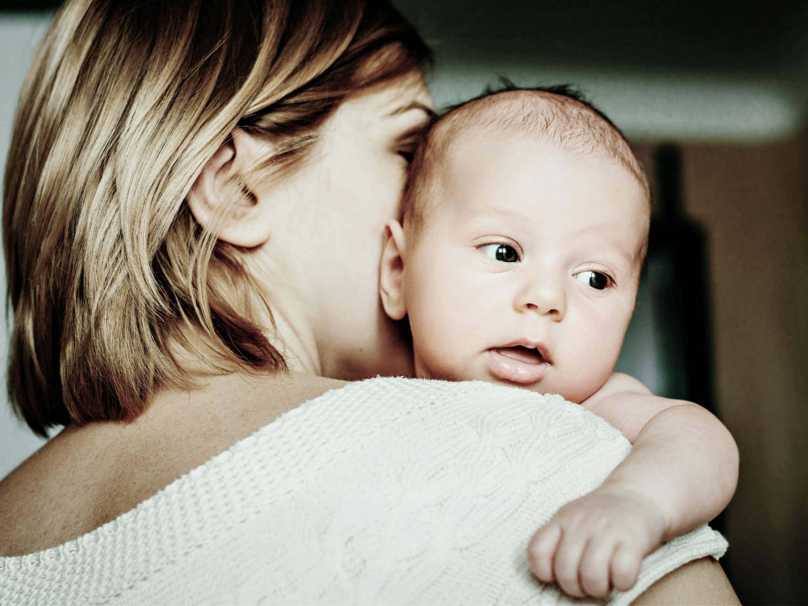 Portrait of a happy mother and baby at home. Happy motherhood