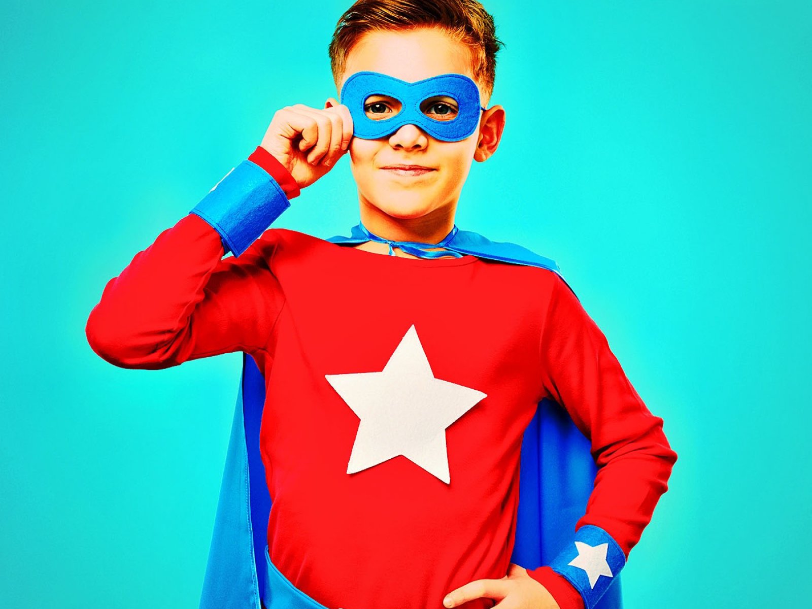Brave boy in superhero costume